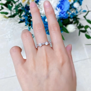 Macro shot of S925 sterling silver beaded ring with sparkling round stones in shared-prong