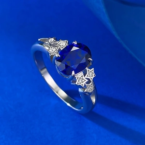 Elegant S925 silver ring featuring an oval blue sapphire and star-shaped side stones
