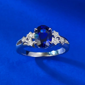 Elegant 925 silver ring with large oval blue stone and star side accents