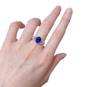 S925 silver ring featuring a large oval blue sapphire with micro-pave diamond band setting