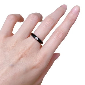 Minimalist S925 stackable black enamel ring with marquise-cut center gemstone on hand