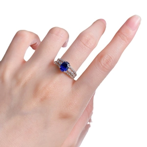 Three-piece S925 silver ring set featuring oval sapphire and marquise pavé stones