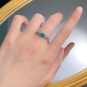 Detailed view of the S925 silver ring featuring a Paraiba blue stone and micro-pave diamonds