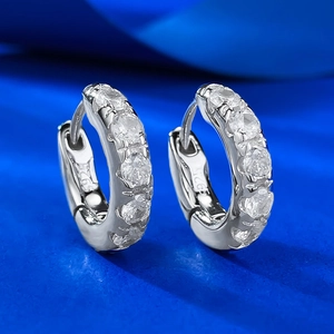 Sparkling S925 sterling silver hoop earrings with clear cubic zirconia on blue velvet
