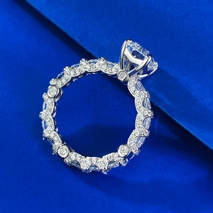 Macro shot of S925 sterling silver ring with pavé band and large round diamond center