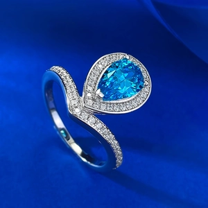 Elegant S925 silver pear-cut blue gemstone ring with V-shaped crown band and diamonds