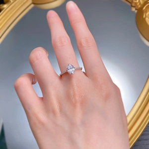 Macro detail of 925 silver ring featuring oval solitaire and pave-set diamond band