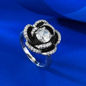 S925 silver camellia ring featuring black enamel petals and a central round white gem