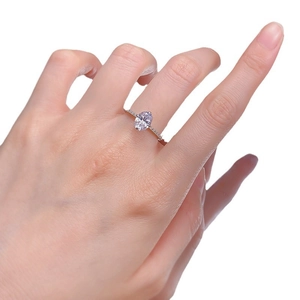 Elegant 925 sterling silver ring with an oval cut light purple gemstone and pavé accents
