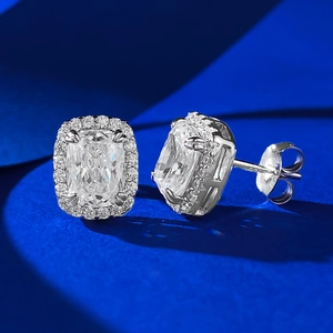 Macro shot of 2-carat cushion-cut S925 silver stud earrings with a sparkling halo