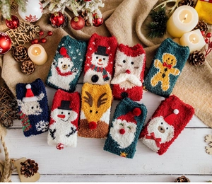 Collection of festive thick coral fleece Christmas socks with various holiday patterns