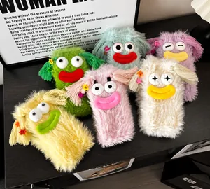 Detailed view of colorful fuzzy monster socks with cute big eyes and creative hair clips