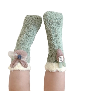 Thick coral fleece warm winter socks for kids featuring cute rabbit ears and bow decoration