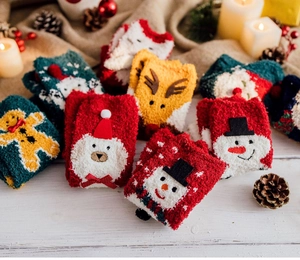 Detail of Christmas coral fleece socks with plush bear and reindeer cartoon patterns