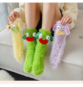 Detailed plush texture and 3D funny eye decorations on colorful winter cartoon socks