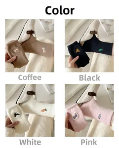 Detail of four colors soft coral fleece socks with cute animal embroidery for winter