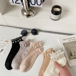 Detail of 5 pairs of sheer lace socks with pearl trim in black, beige and khaki colors