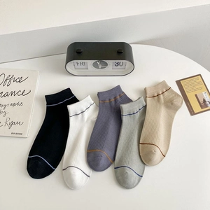 Detail view of five-pair set breathable cotton boat socks in various neutral tones