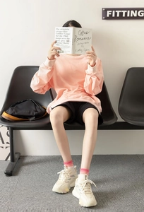 Detail of pink striped cotton socks with retro platform sneakers for casual sporty style