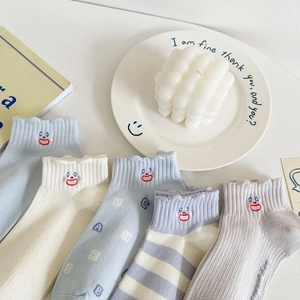 Blue cotton crew socks with cute smiley embroidery and ruffled cuffs for women