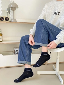 Men's black cotton low-cut socks with light blue stripe accent and breathable ribbed texture