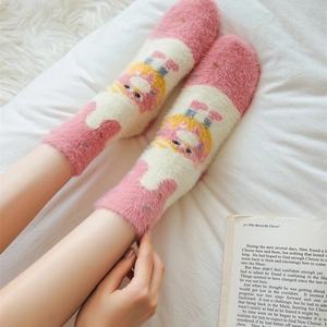 Pink and white fuzzy crew socks with cartoon design for warm autumn and winter comfort
