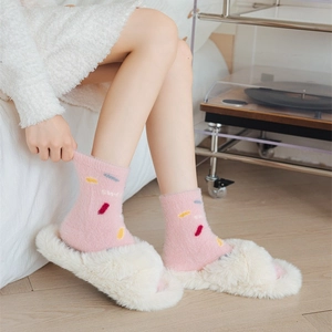 Pink coral fleece crew socks with colorful embroidery and white plush slippers set