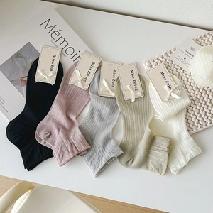 Five-pack of ribbed soft cotton socks in assorted pastel colors with stylish bow labels
