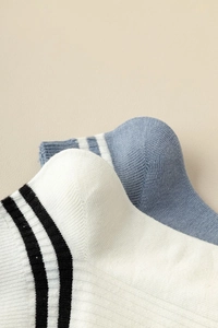 Detail of breathable rib texture and elastic cuff on striped cotton low-cut boat socks