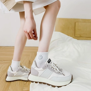 Chunky cream dad sneakers with mesh panels and embroidered smiley face white socks