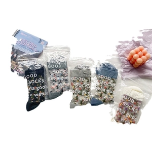 Five pairs of Japanese style floral embroidered sheer glass socks in assorted colors