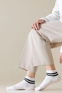 Detail of white cotton crew socks with double black stripes for a casual business look