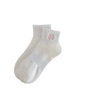 White cotton sports socks with pink smiley embroidery and comfortable ribbed cuffs