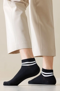 Detail of black low cut socks with white double stripes and ribbed cuffs for men