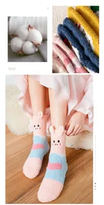 Detail of pink and blue striped coral fleece socks with cute 3D cartoon pig design