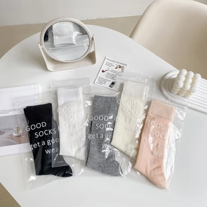 Detailed view of 5-pack ballet style mesh socks in various colors with ribbon accents