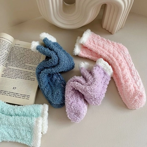 Thick fuzzy coral fleece thermal socks with non-slip grips and cozy cable knit for winter