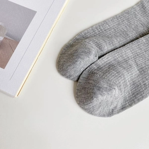 Detailed macro view of gray knitted fabric texture and seamless toe of ballet socks