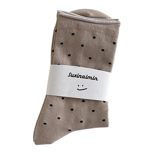 Khaki mid-calf socks with black polka dots and rolled cuff design for a vintage aesthetic