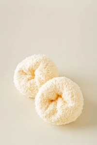 Detailed view of soft cream white coral fleece texture on thick warm fuzzy socks