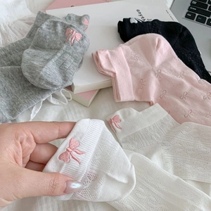 Detail of breathable mesh ankle socks with pink bow embroidery in various colors