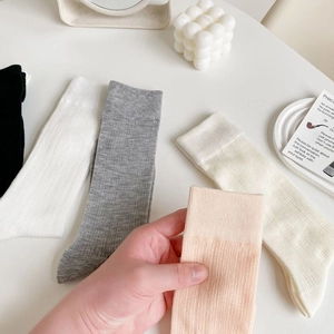 Pastel ballet-style mesh mid-calf socks with bows and hollow knit pattern in various colors