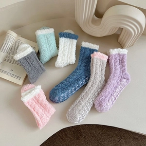 Thick warm coral fleece mid-calf socks with non-slip grip dots in various pastel colors