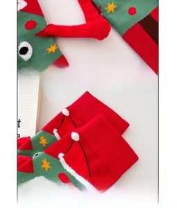 Detail showing magnetic hands design and festive Christmas patterns on knit socks