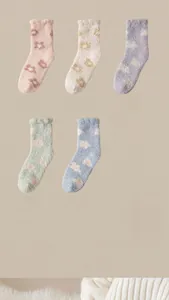 Flat lay of five soft coral fleece socks with floral patterns in pastel colors