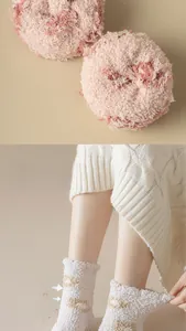 Macro detail of thick pink and white coral fleece socks for warm winter thermal wear