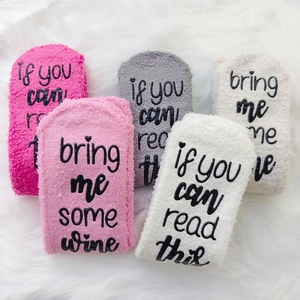 Fuzzy coral fleece socks featuring if you can read this bring me some wine text on soles