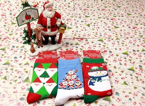 Detailed set of Christmas theme crew socks featuring Santa and Snowman festive patterns