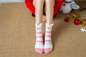 Detail of pink striped coral fleece warm socks with cute 3D pig ears and soft embroidery