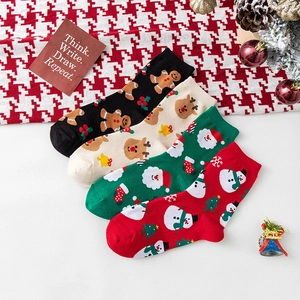 Set of four festive Christmas crew socks featuring reindeer and gingerbread man patterns